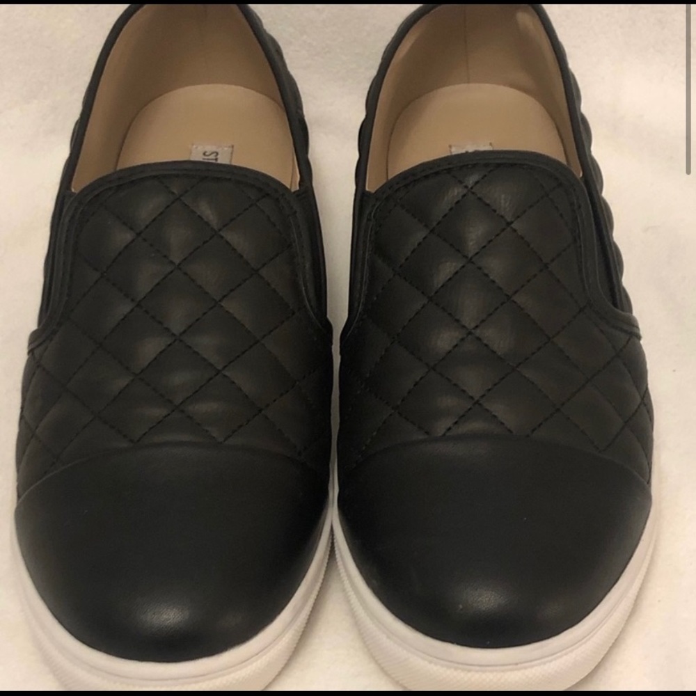 Steve Madden slip ons.